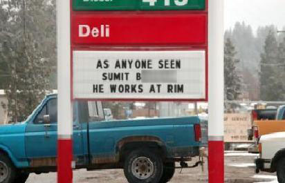 Waterloo gas station sign asking "As anyone seen Sumit B.? He Works at RIM"